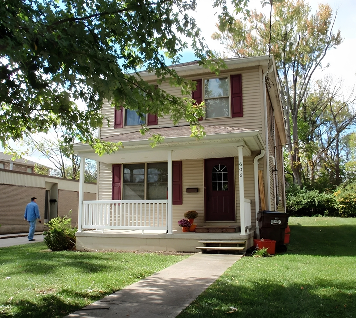 Two-story house with front porch.