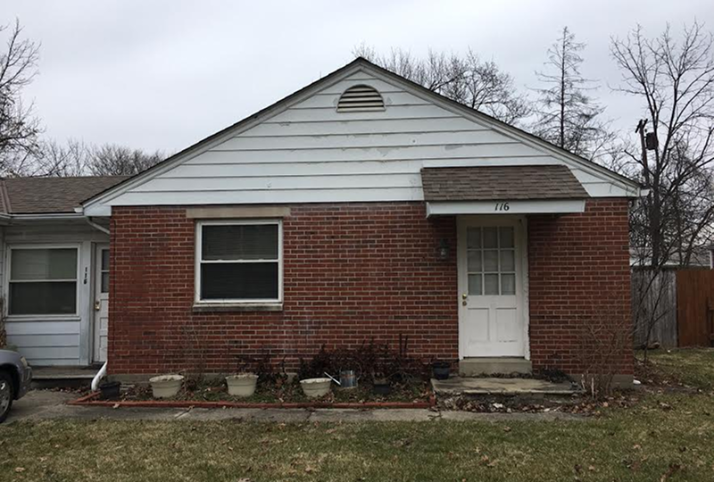 Small brick home, cloudy day