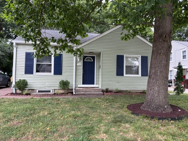 Single-story house with dark blue door