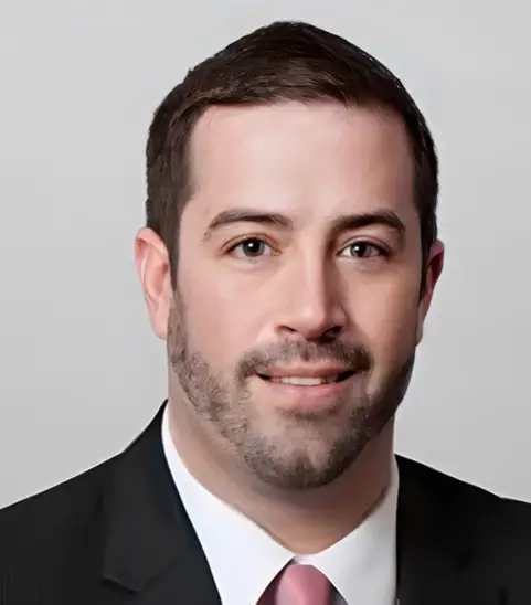 Headshot of smiling man with beard